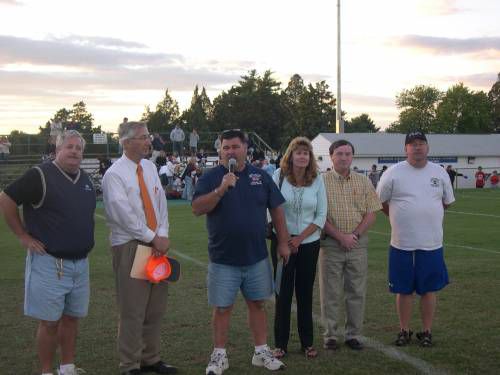 (Left to Right) Nick Macioce, Chairman of the Lower Loudoun Boys Football League's "Field Improvement Project," Supervisor Eugene Delgaudio (R-Sterling) Gary Kidwell, President of LLBFL and a unidentified LLBFL officer, present a Certificate of Appreciation to Belinda and Larry Patrick of Consolidated Mailing Services. These 
other donors are  being thanked: Virginia Commerce Bank, M.C. Dean, Atlantic Realty, Clark Construction, Balfour Beatty Construction, Toll Brothers, Sheets Quality Building Materials and Luck Stone.  LLBFL still continues to raise monies for new bleachers.