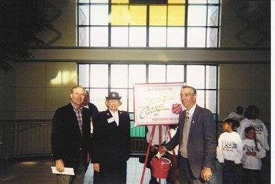 Senator Bill Mims, Salvation Army Representative and ED gives the first donation of the year (2003) for their annual bell ringing campaign