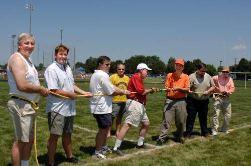 Supervisors Delgaudio, Mick Staton and Steve Snow were joined by former Supervisor Senator Mark Herring (on the right) and School Board members (left to right) Tom Reed, John Andrews, Robert Dupree, and Warren Geurin in tug of war on the Park View HS Football field July 16 during a half time charity football game to help Discovery Park.