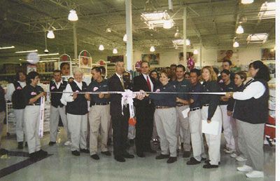 ED and Supervisor Bill Bogard cut the ribbon at Babies R Us