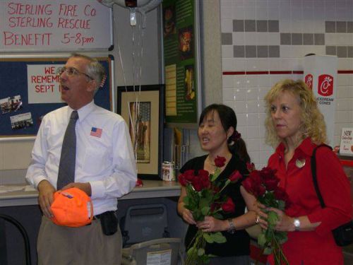 Roses presented to the volunteers of the Sterling Fire Dept. by the ladies of Chick-Fil-A.