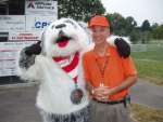 Supervisor Eugene Delgaudio (right) meets Sweet T the mascot at the Babe Ruth baseball games in Purcellville.